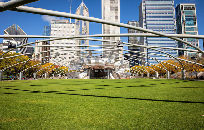 a park in the city with skyscrapers in the background