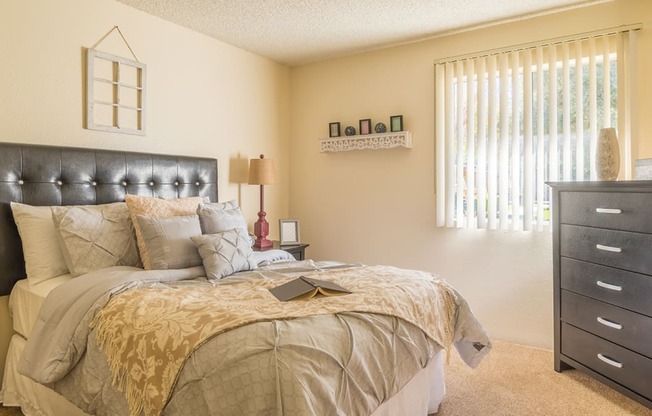 The Springs bedroom with nice natural lighting and carpet flooring