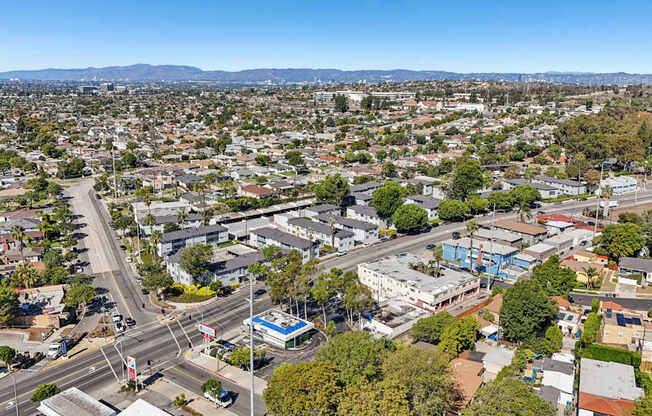 A cityscape with a clear blue sky above.