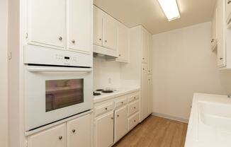 Kitchen with White Appliances and White Cabinets