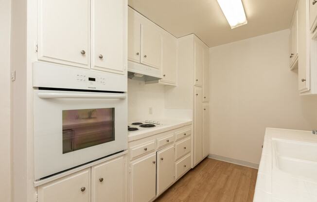 Kitchen with White Appliances and White Cabinets