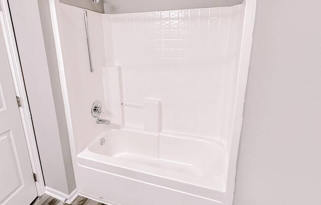 a small bathroom with a shower and a toilet