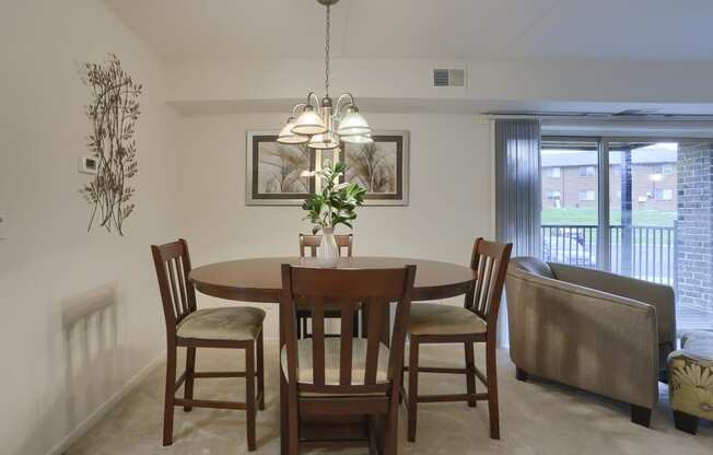 Apartments in Harrisburg | Twin Lakes Apartments | a dining room with a table and chairs