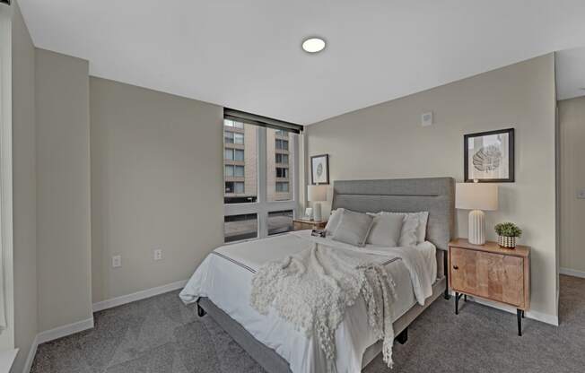 a bedroom with a large bed and a window