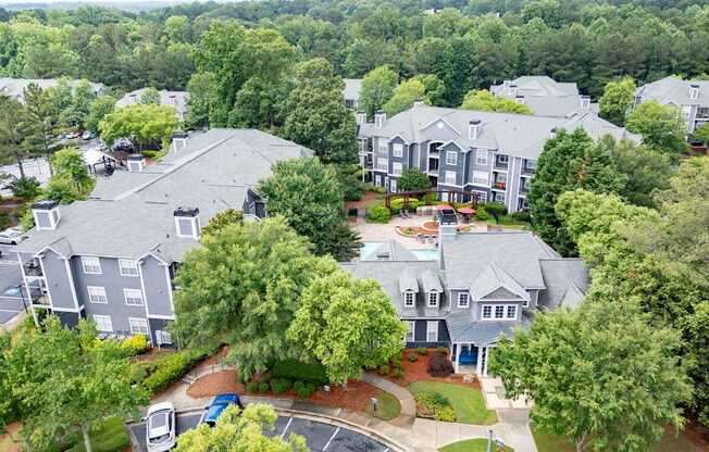 A bird's eye view of a residential area with houses and trees.