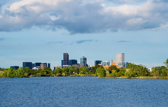 Experience the perfect blend of urban living and natural beauty with this breathtaking lakeside city view.