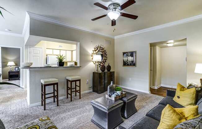 A living room with a grey couch and a coffee table.