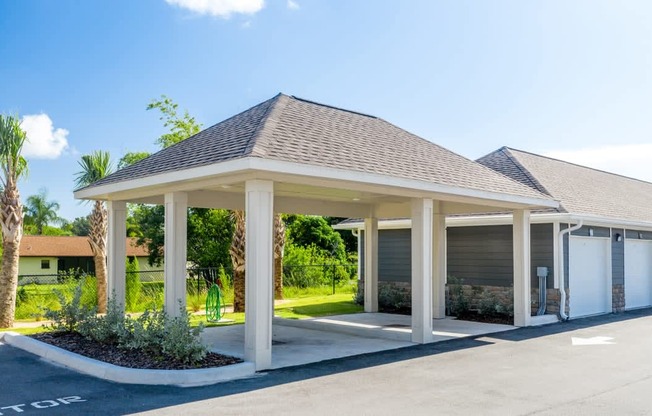 A building with a parking lot in front of it at Mode at Melbourne, LLC Apartments, Melbourne, Florida