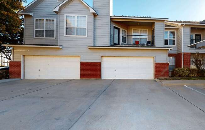 a car garage in front of an apartment