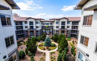 aerial view of grand landscaping and exterior of terracina building