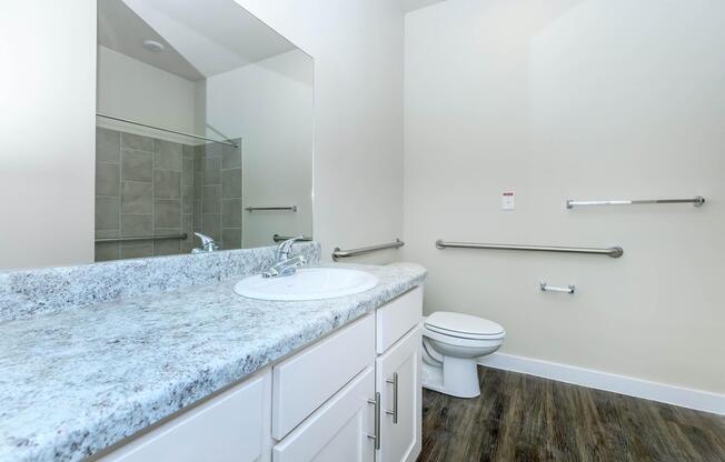 Apartments in Leander TX - Hills at Leander Expansive Bathroom with a Large Vanity, Shower, and Much More