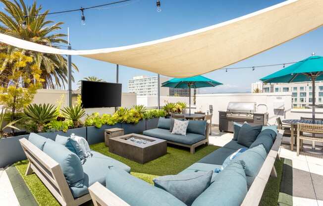 a rendering of a rooftop patio with couches and umbrellas