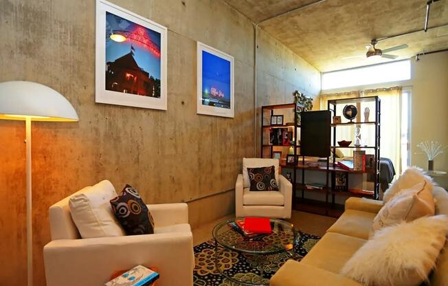 a living room with couches and chairs and a table