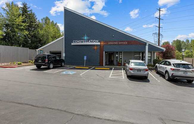 A parking lot in front of a building with the words