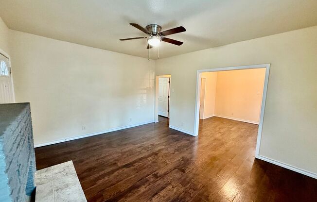 Newly renovated home with all the modern touches: Wood-laminate floors, Stainless Steel Appliances, New Cabinets and Countertops, Large Bedrooms & Backyard