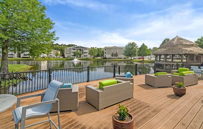 the preserve at ballantyne commons clubhouse with patio furniture overlooking the water