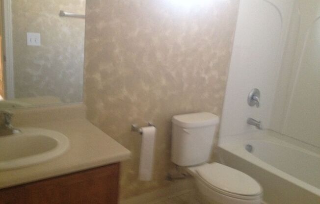 3 Bed/2.5 bath. All Tile Downstairs. Open Great Room floor plan.