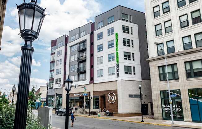 a building with a green neon sign on the side of it