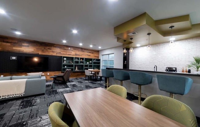 a living room and dining room with a table and chairs at 310 at Nulu Apartments-Student, Kentucky