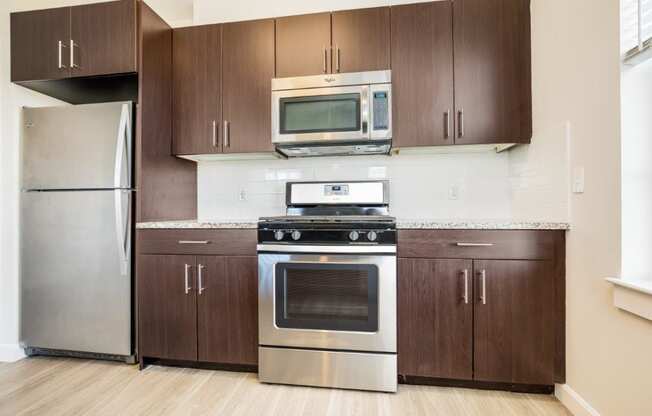 Fully Equipped Kitchen Includes Frost-Free Refrigerator, Electric Range, & Dishwasher at East Main, Massachusetts
