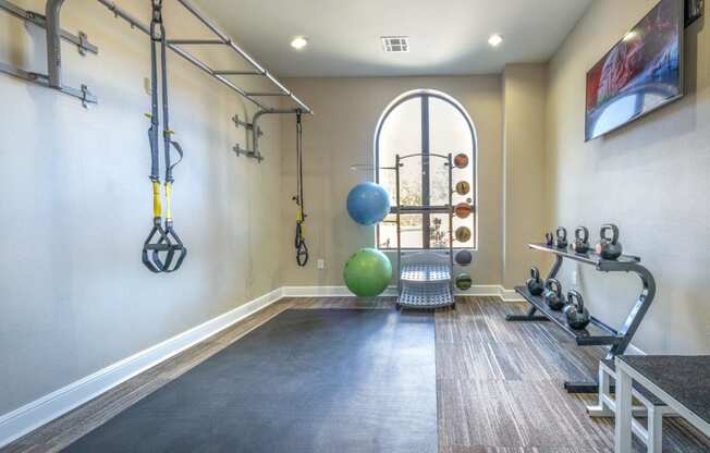 a workout room at the district flats apartments in lenexa, ks