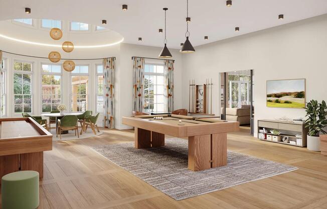 Game room with billiards, shuffleboard, poker table, and comfortable seating at Modera South Shore in Marshfield, MA.