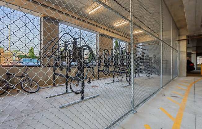 A chain link fence encloses a parking area.