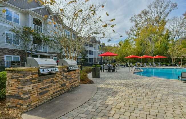 our apartments have a pool and a patio with umbrellas