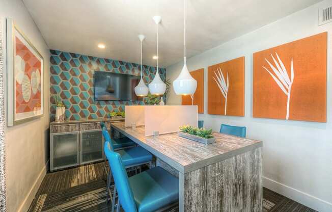 A dining area with a wooden table and blue chairs.