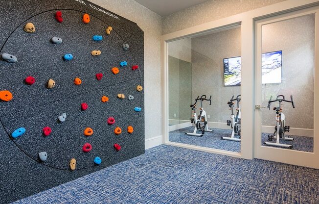 Rock climbin wall in Fitness center and bikes