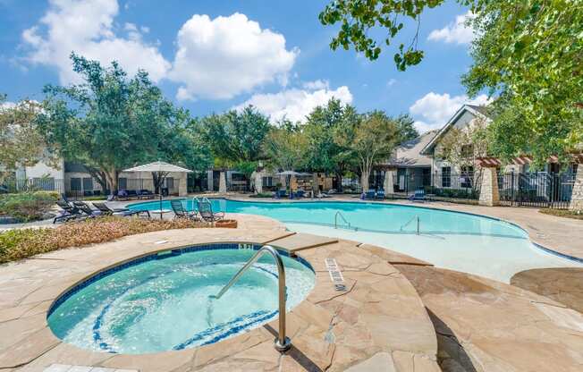 the preserve at ballantyne commons pool and spa with trees and a pool house