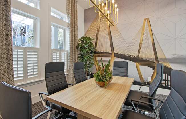 a conference room with a wooden table and chairs