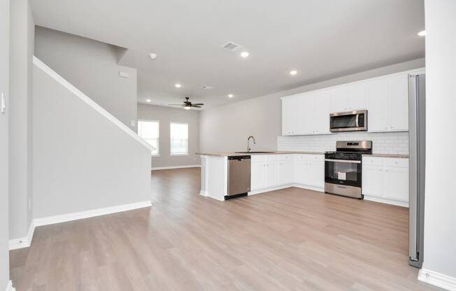 the living room and kitchen in a 555 waverly unit