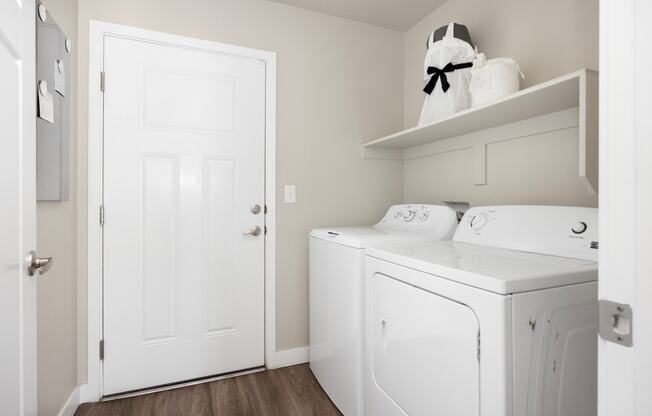 a laundry room with a washer and dryer