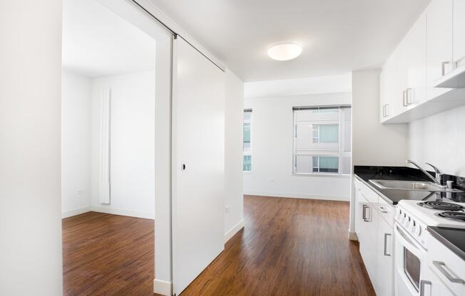 a kitchen and living room in a 555 waverly unit