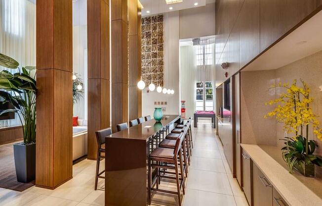 a long table with chairs in a lobby