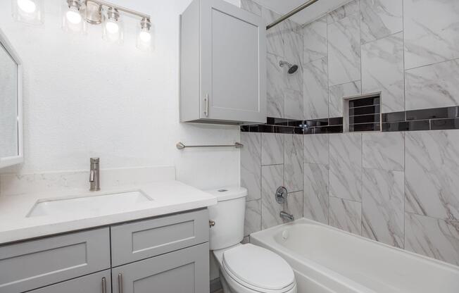 a kitchen with a sink and a mirror