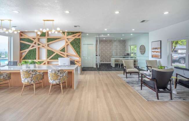 A modern office space with wooden floors and furniture.