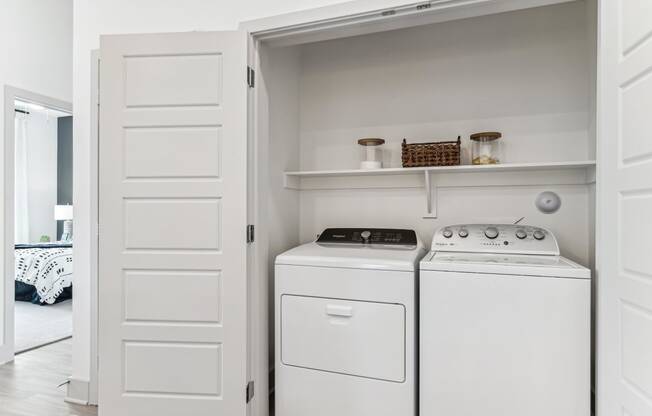 a small laundry room with a washer and dryer