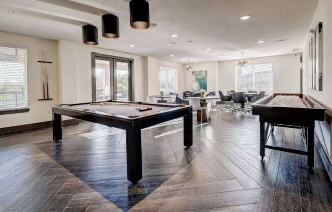 a game room with a pool table and a bar at The Jane at Preston Trail, Cedar Hill