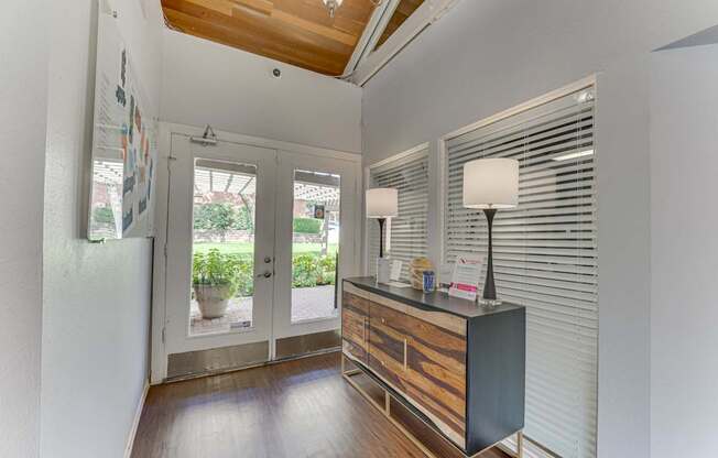 A room with a wooden ceiling and a black and brown cabinet at Copper Hill Apartments, Bedford 76021