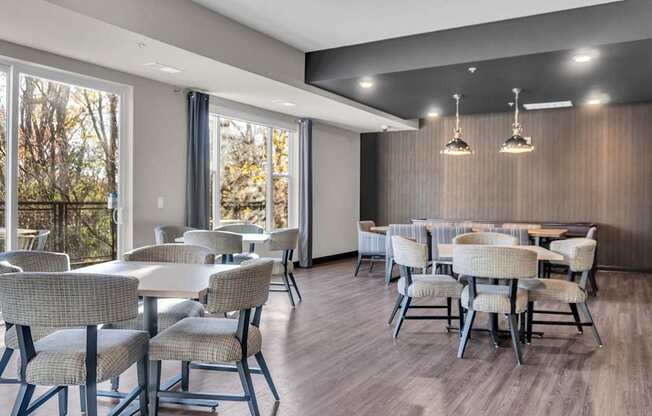 A dining room with a long table and chairs.