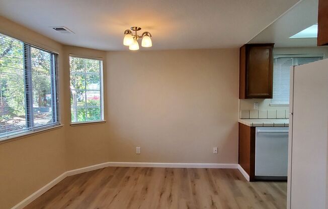 Spacious Downstairs Condo, New Wood Flooring, Fresh Paint, 1 Car Garage, Pool, Hot Tub, Patio!