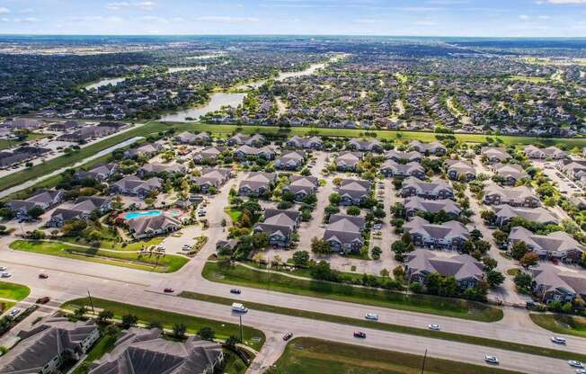 an aerial view of a neighborhood of houses and roads at Sladestone Shadow Creek, Pearland, TX