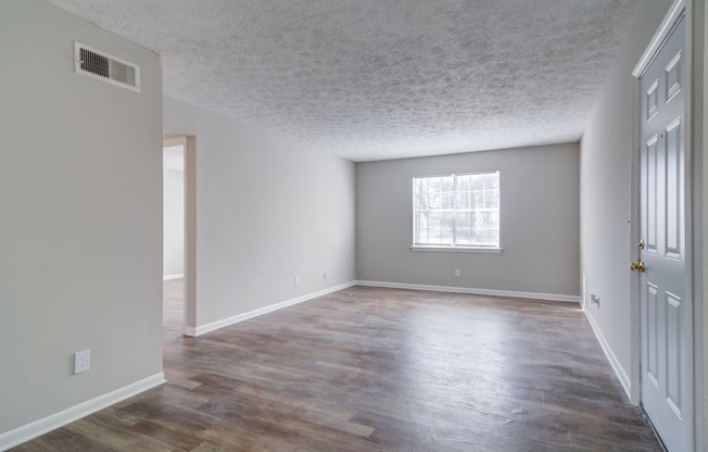 Stone mountain, ga, apartment the living room and dining room of an empty house