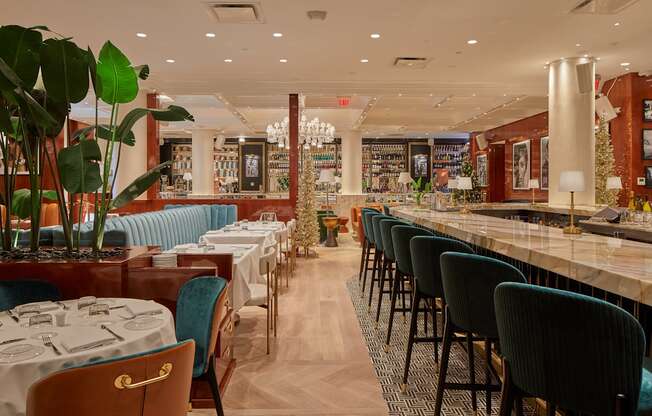 A restaurant with tables and chairs set up for dining.