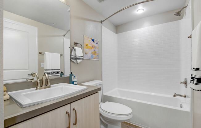 a bathroom with a sink toilet and bathtub