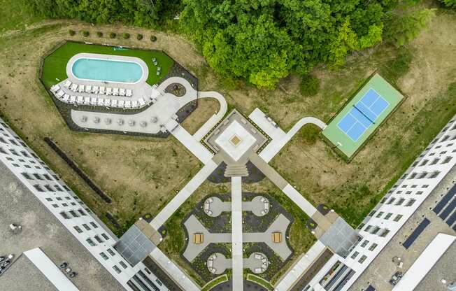 A large building with a pool in the middle of it.