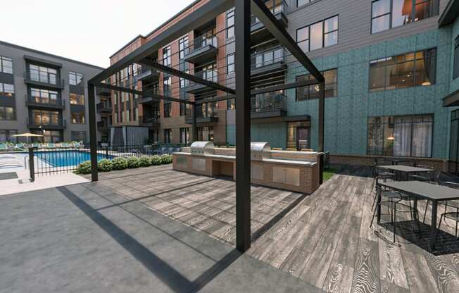 Gas grills at large pool courtyard at Link Apartments® Broad Ave near Kordova in Memphis, TN.