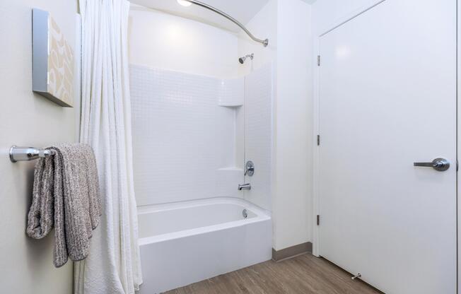 Daly City IL Apartments-Brunswick Street Bathroom with Well Lit and Spacious Vanity, Large Shower Area, and Plenty of Storage Space